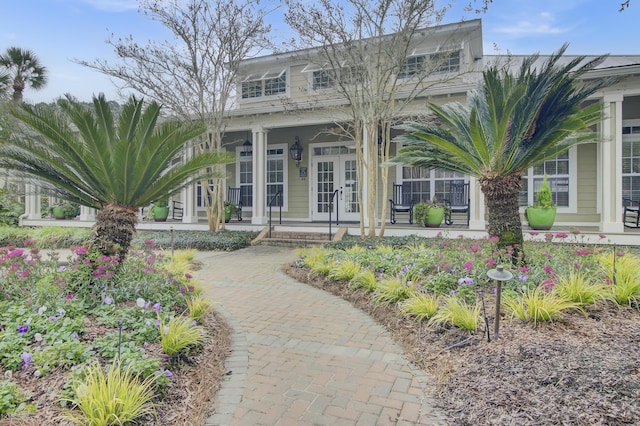 view of front facade featuring a porch and french doors