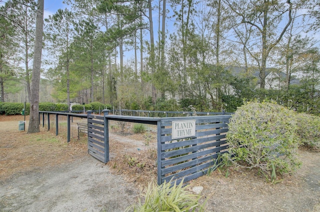 view of gate featuring fence