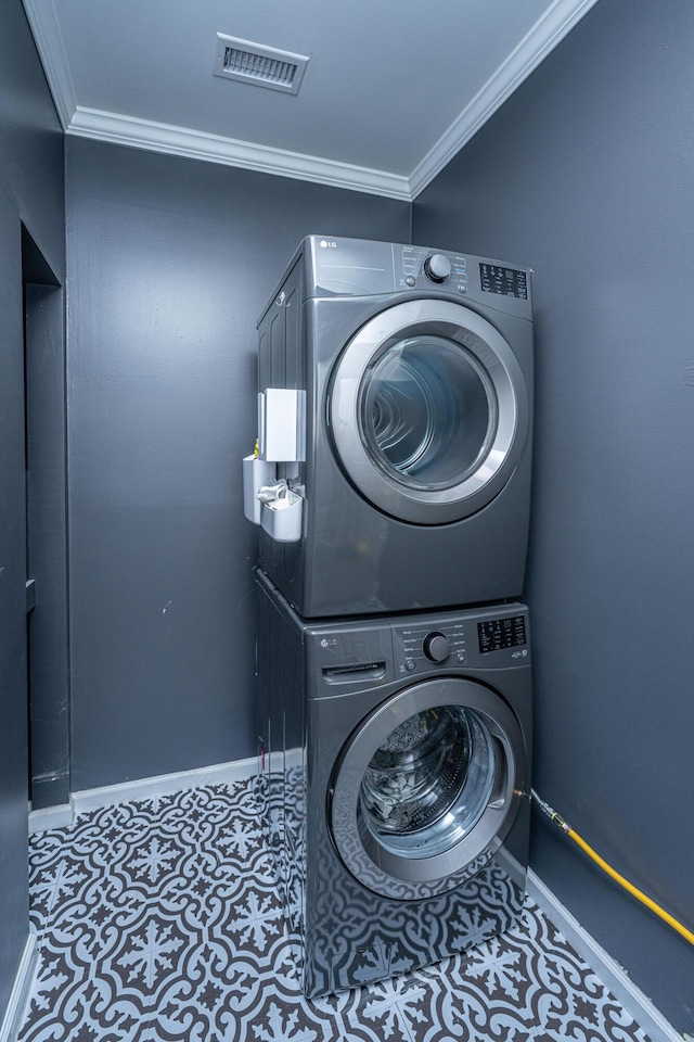 1520 Regimental Ln, Johns Island, SC 29455 - washroom featuring stacked washer / dryer and crown molding