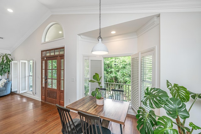 1520 Regimental Ln, Johns Island, SC 29455 - dining space featuring lofted ceiling, plenty of natural light, wood finished floors, and ornamental molding
