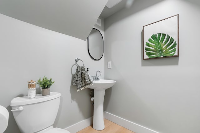 886 Friendly Cir, Charleston, SC 29414 - half bath featuring toilet, baseboards, and wood finished floors