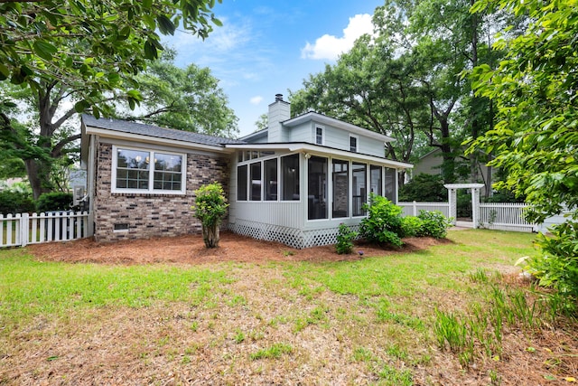 886 Friendly Cir, Charleston, SC 29414 - rear view of house featuring a sunroom, a chimney, brick siding, and crawl space