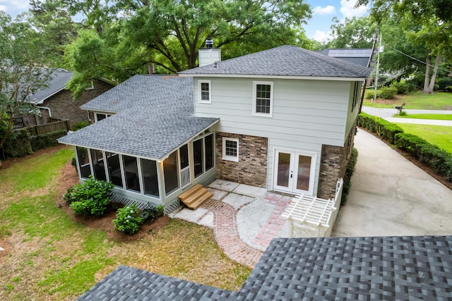 886 Friendly Cir, Charleston, SC 29414 - back of house with a sunroom, french doors, a shingled roof, and a chimney