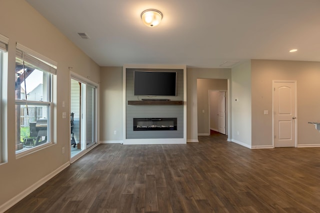 408 Fox Sparrow Ct, Summerville, SC 29486 - unfurnished living room with dark wood-style flooring, baseboards, a large fireplace, and recessed lighting
