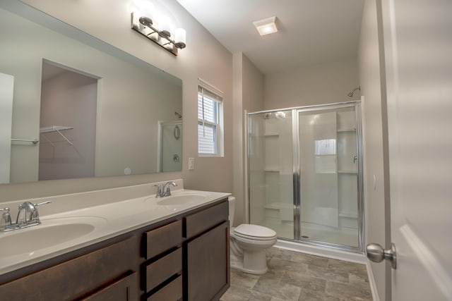 408 Fox Sparrow Ct, Summerville, SC 29486 - bathroom with a shower stall, toilet, double vanity, and stone finish flooring