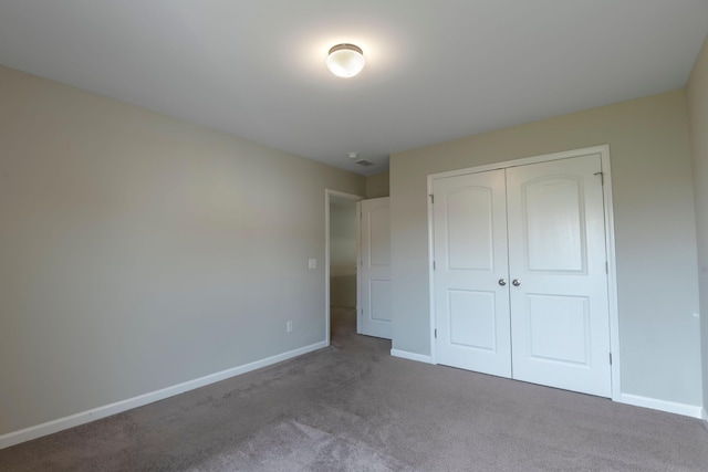 408 Fox Sparrow Ct, Summerville, SC 29486 - unfurnished bedroom with dark carpet, baseboards, and a closet