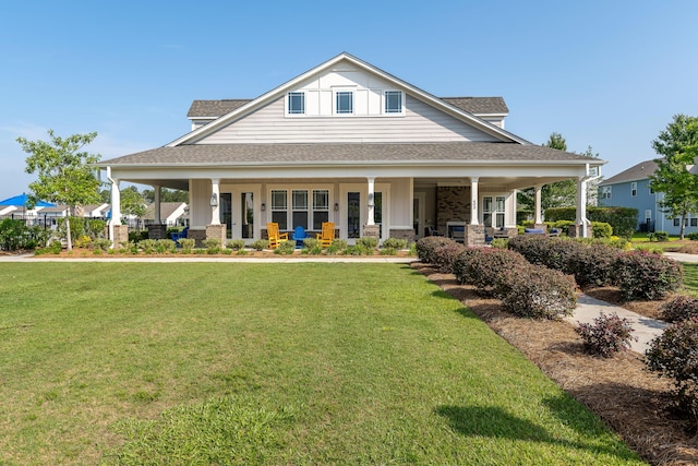 408 Fox Sparrow Ct, Summerville, SC 29486 - view of front of home featuring covered porch, a front lawn, roof with shingles, and board and batten siding