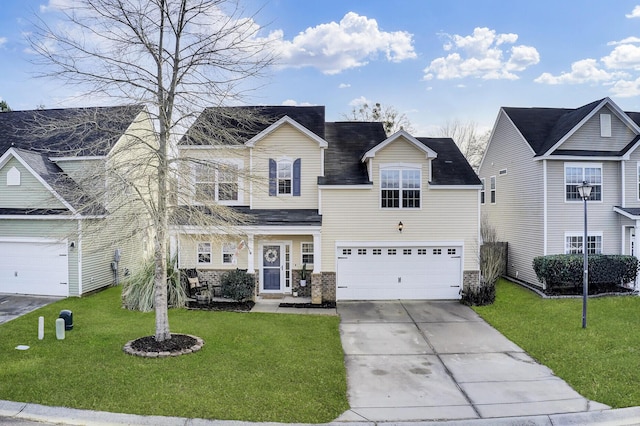 view of front of property with a garage and a front lawn