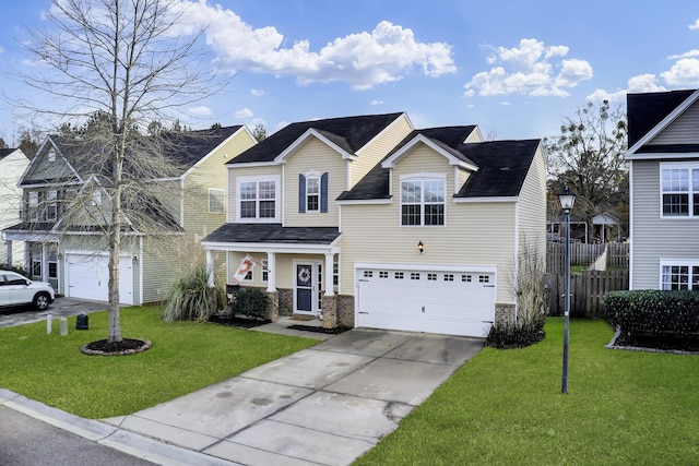 view of property with a garage and a front yard