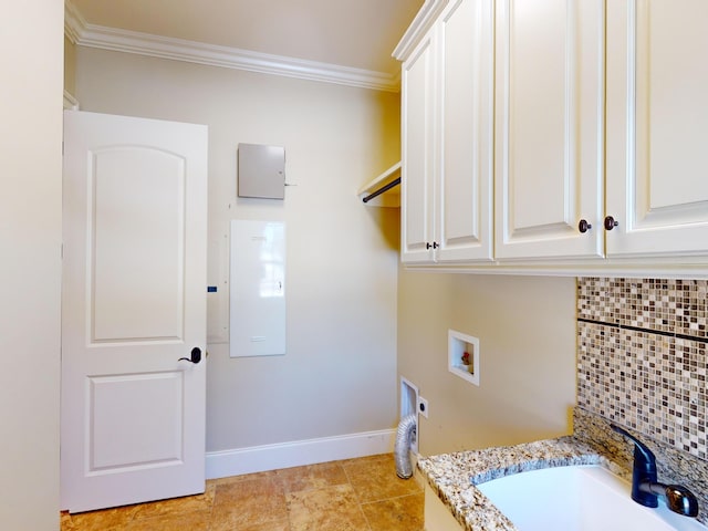 clothes washing area with ornamental molding, electric dryer hookup, sink, and washer hookup