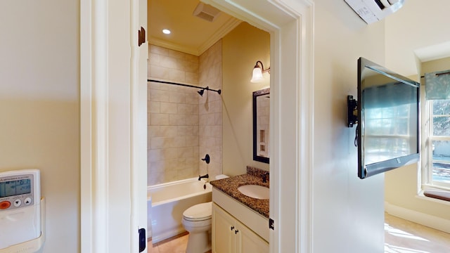 full bathroom featuring vanity, toilet, and tiled shower / bath