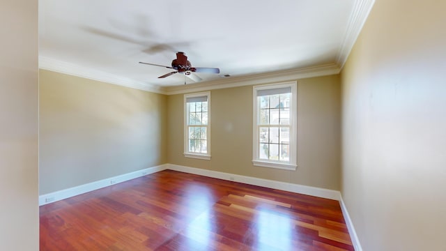 spare room featuring hardwood / wood-style flooring, crown molding, and ceiling fan