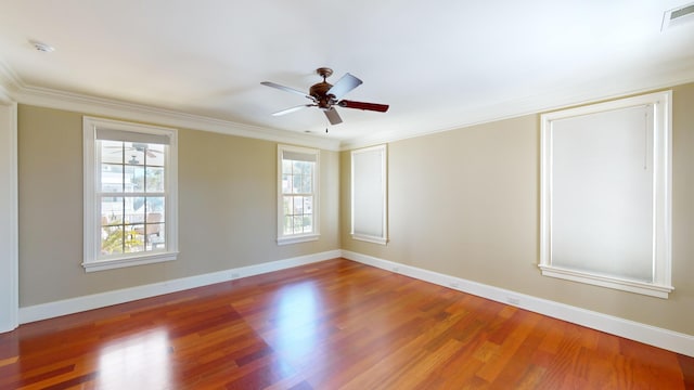 unfurnished room with crown molding, wood-type flooring, and ceiling fan