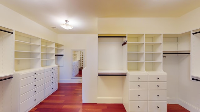 walk in closet with hardwood / wood-style floors