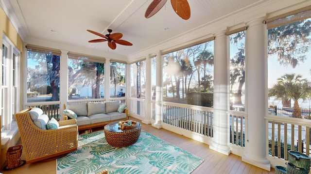 sunroom featuring ceiling fan and a healthy amount of sunlight