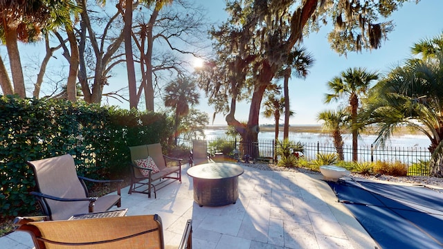 view of patio / terrace with a water view