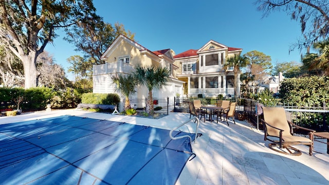 rear view of house featuring a patio