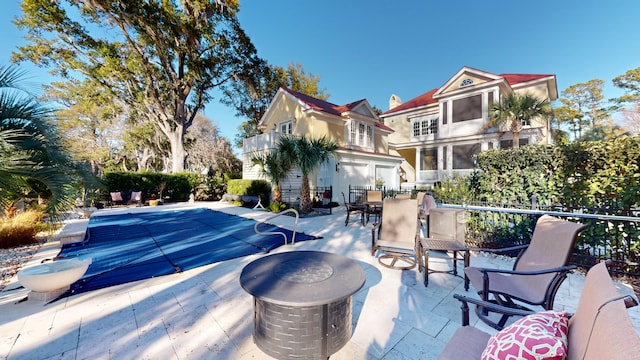 view of pool featuring a patio area