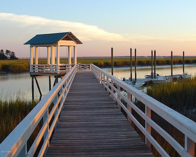 dock area featuring a gazebo and a water view