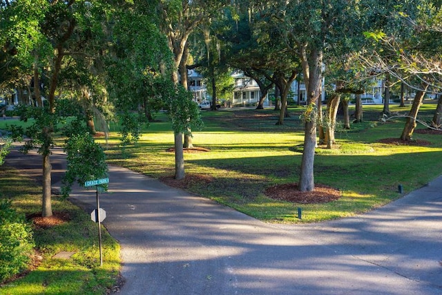 surrounding community featuring a lawn