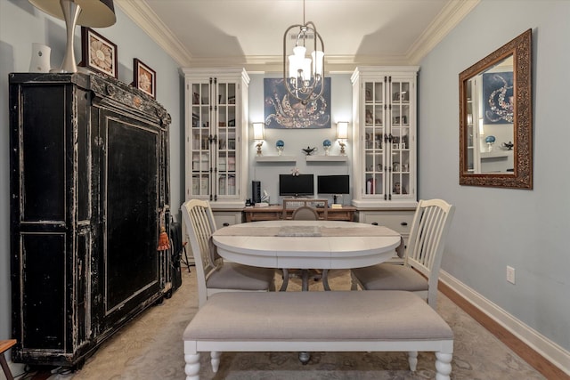 dining room with crown molding and a chandelier