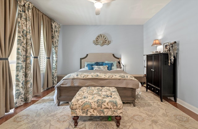 bedroom with light wood-type flooring and ceiling fan