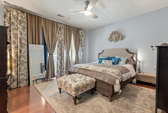 bedroom featuring wood-type flooring and ceiling fan