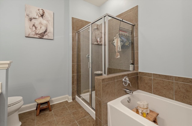 bathroom featuring shower with separate bathtub, tile patterned floors, and toilet