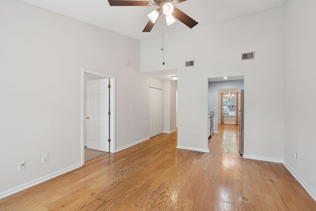 1505 Blaze Ln, Charleston, SC 29412 - unfurnished room featuring a ceiling fan, light wood-style floors, and a high ceiling
