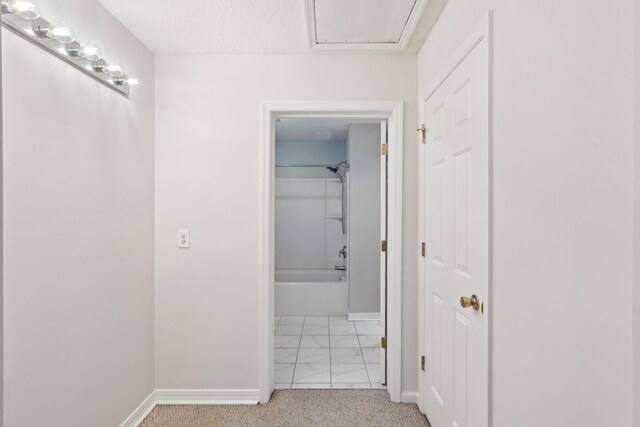 1505 Blaze Ln, Charleston, SC 29412 - hallway with light marble finish flooring, light colored carpet, and a textured ceiling