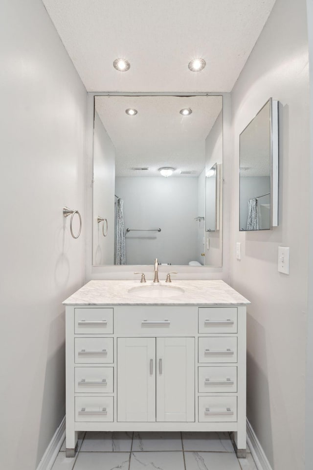 1505 Blaze Ln, Charleston, SC 29412 - bathroom with marble finish flooring, vanity, and recessed lighting