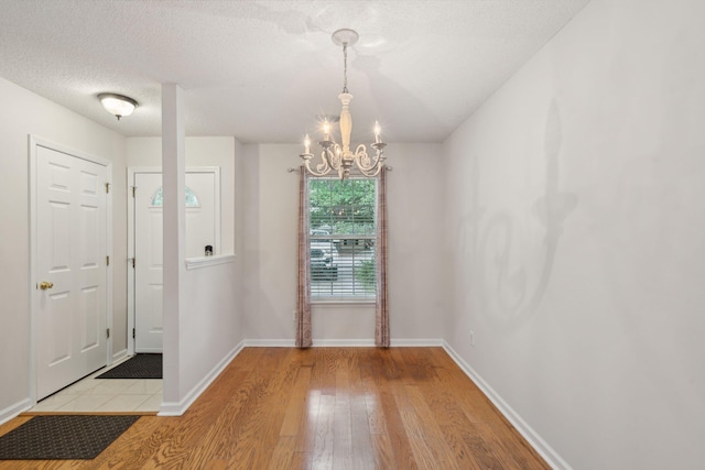 1505 Blaze Ln, Charleston, SC 29412 - entrance foyer featuring a chandelier, light wood-type flooring, and a textured ceiling