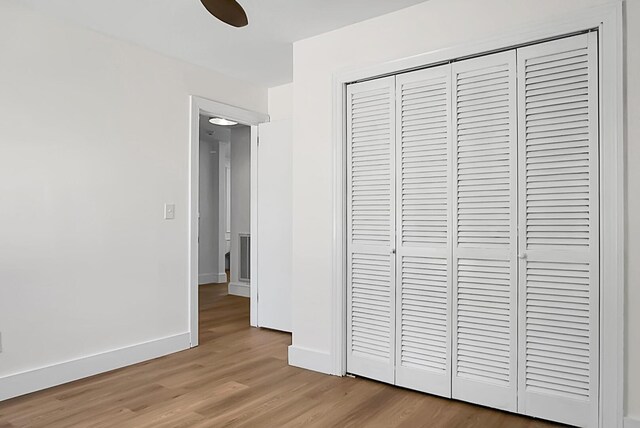 5259 Hartford Cir N, Charleston, SC 29405 - unfurnished bedroom featuring a closet, light wood-style floors, baseboards, and a ceiling fan