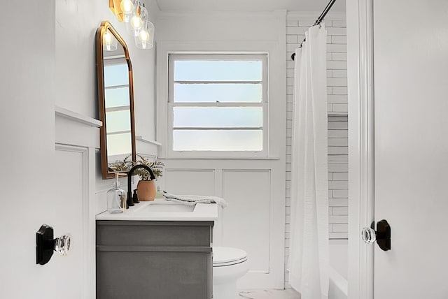 5259 Hartford Cir N, Charleston, SC 29405 - bathroom with vanity, toilet, marble look tile flooring, shower / bath combo with shower curtain, and a decorative wall