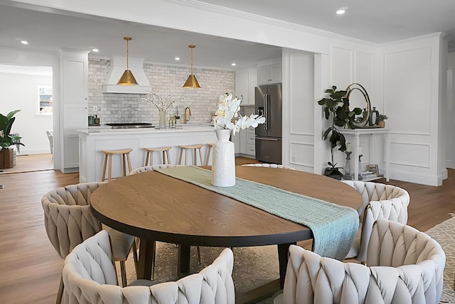 5259 Hartford Cir N, Charleston, SC 29405 - dining room with light wood finished floors and recessed lighting