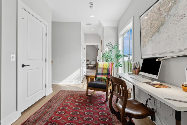 home office featuring built in study area, recessed lighting, light wood-type flooring, and visible vents