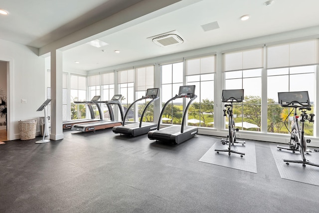 exercise room with recessed lighting and visible vents