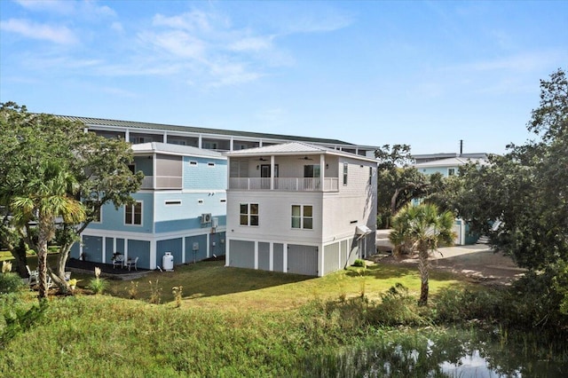 exterior space with a lawn and a balcony