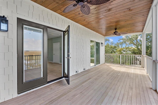 wooden deck featuring ceiling fan