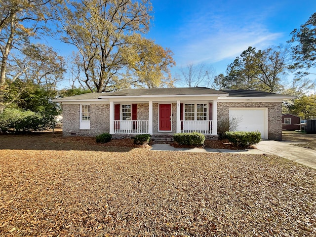 ranch-style home with a porch and a garage