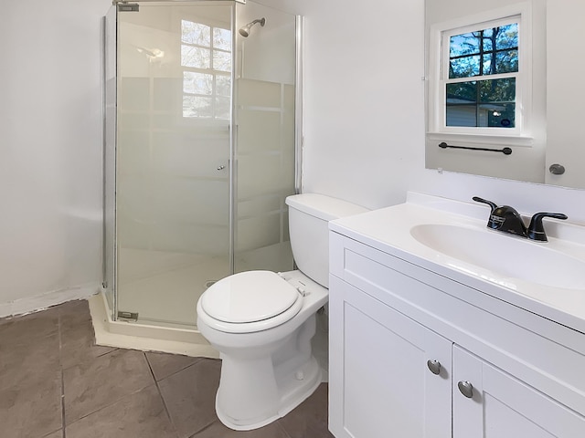 bathroom with tile patterned floors, a wealth of natural light, an enclosed shower, and toilet