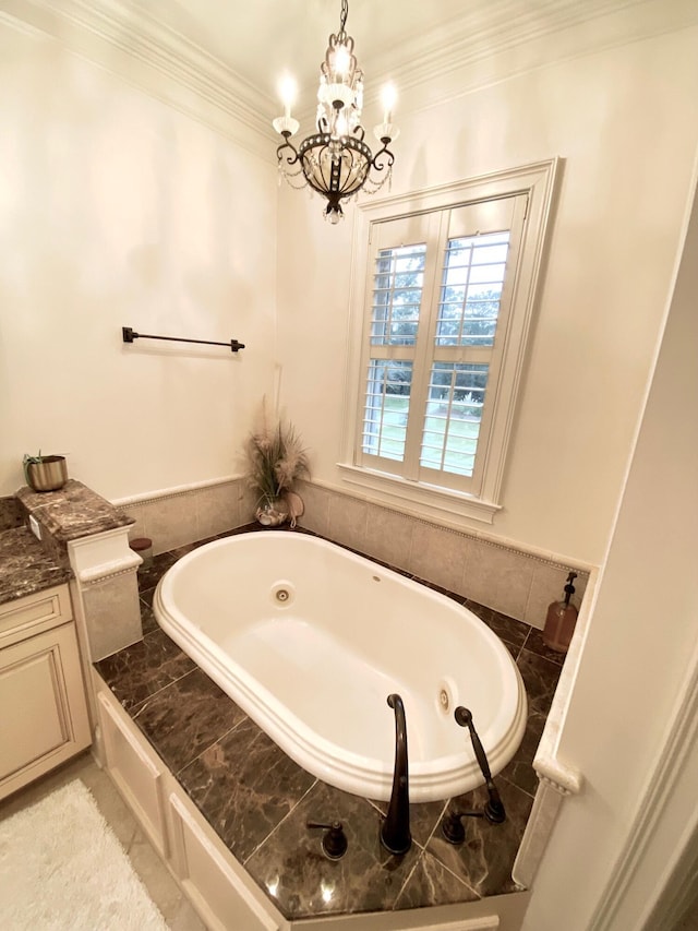 full bath featuring a tub with jets, a chandelier, and crown molding