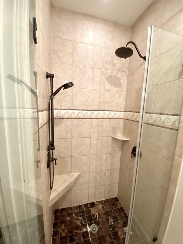 full bath featuring a shower stall