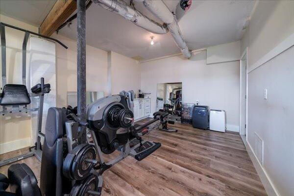 exercise area featuring wood finished floors