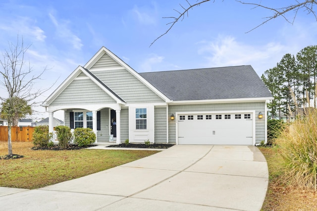 view of front of home featuring a garage and a front yard