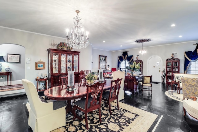 dining space featuring arched walkways, a chandelier, ornamental molding, and recessed lighting