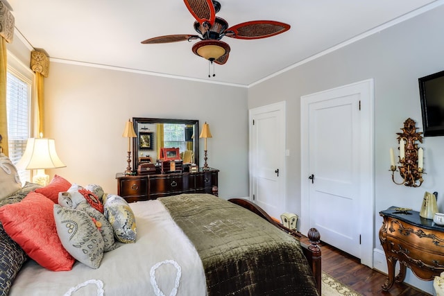 bedroom with ceiling fan, wood finished floors, and ornamental molding