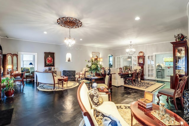 living room with an inviting chandelier and recessed lighting