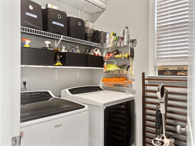 laundry area featuring washer and clothes dryer and laundry area