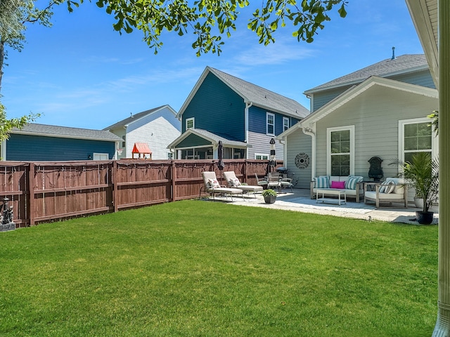 view of yard with a patio, an outdoor hangout area, and fence